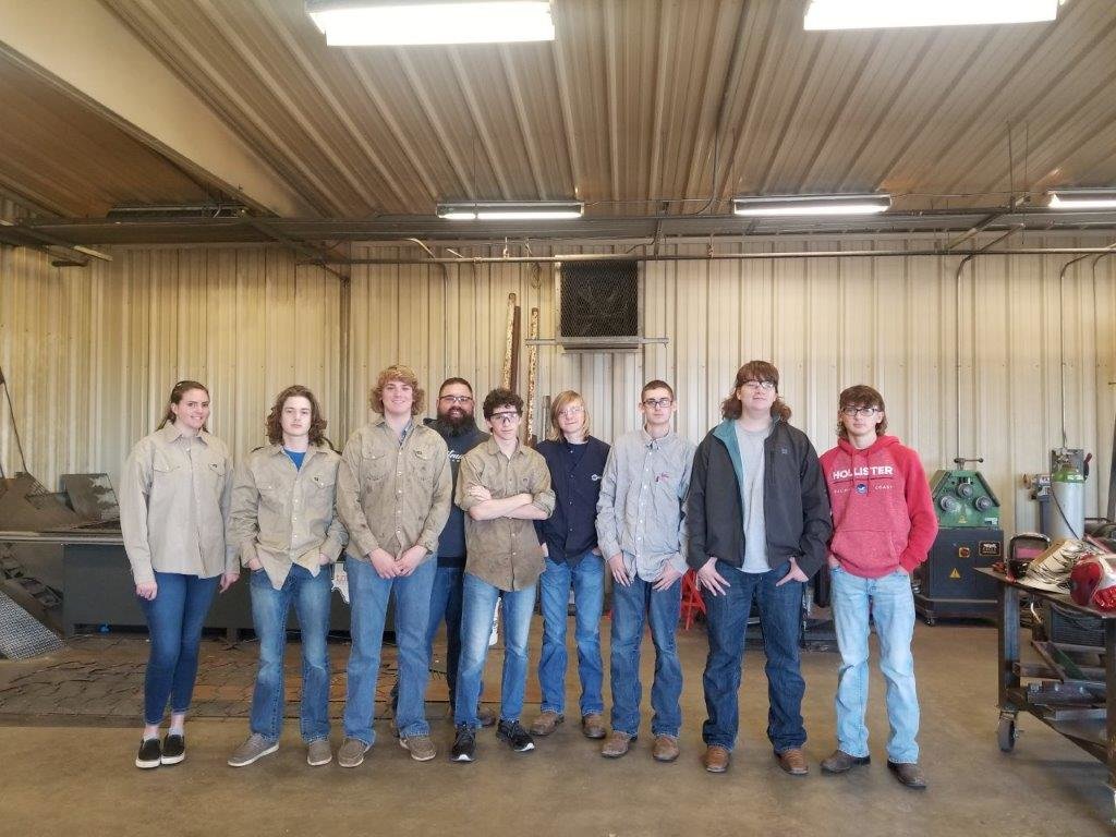 Students working on welding new pole mounts for downtown Christmas decorations were (from left) Josie Sawyer, Pepper Barnes, Parker Simpkins, agriculture teacher Brant Lee, Xander Gonyea, Tommy Drinkwine, Wyatt Rushing, Jesse Bell and Hunter Wilcox.